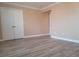 Bedroom with double doors and wood-look floors at 8101 W Flamingo Rd # 2040, Las Vegas, NV 89147