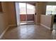 Dining area with tile floor and sliding door to balcony at 8101 W Flamingo Rd # 2040, Las Vegas, NV 89147