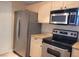 Kitchen with stainless steel appliances and light wood cabinets at 8101 W Flamingo Rd # 2040, Las Vegas, NV 89147