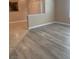 Living room featuring grey wood-look flooring and tile at 8101 W Flamingo Rd # 2040, Las Vegas, NV 89147