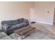 Living room with grey sofa and coffee table at 8101 W Flamingo Rd # 2040, Las Vegas, NV 89147