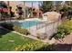 Community pool with surrounding landscaping and fencing at 8101 W Flamingo Rd # 2040, Las Vegas, NV 89147