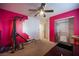 Pink bedroom with a closet and home gym equipment at 8145 Dancing Ave, Las Vegas, NV 89131