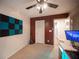 Bedroom with acoustic panels, a gaming setup, and an adjacent hallway at 8145 Dancing Ave, Las Vegas, NV 89131