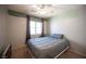 Guest bedroom with ceiling fan and window at 8145 Dancing Ave, Las Vegas, NV 89131