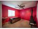 Pink bedroom with home gym equipment and window at 8145 Dancing Ave, Las Vegas, NV 89131