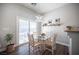 Bright dining area with glass-top table and four chairs at 8145 Dancing Ave, Las Vegas, NV 89131