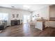 Open dining area with glass table and chairs, hardwood floors at 8145 Dancing Ave, Las Vegas, NV 89131