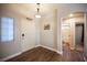 Bright entryway with wood floors and access to bathroom at 8145 Dancing Ave, Las Vegas, NV 89131