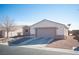 House exterior showcasing a two-car garage and driveway at 8145 Dancing Ave, Las Vegas, NV 89131