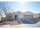 Single story home featuring a two-car garage and front yard at 8145 Dancing Ave, Las Vegas, NV 89131