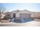 One-story house with attached garage and landscaping at 8145 Dancing Ave, Las Vegas, NV 89131