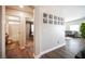 Bright hallway with wood-look floors, leading to bathroom and bedroom at 8145 Dancing Ave, Las Vegas, NV 89131