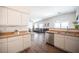 Modern kitchen with white cabinets, stainless steel appliances, and hardwood floors at 8145 Dancing Ave, Las Vegas, NV 89131