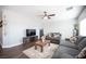 Relaxing living room with gray sectional sofa and coffee table at 8145 Dancing Ave, Las Vegas, NV 89131