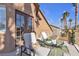 Relaxing balcony with lounge chairs, offering a view of the backyard pool at 8501 Vivid Violet Ave, Las Vegas, NV 89143