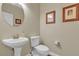 Well-appointed bathroom with pedestal sink and toilet at 8501 Vivid Violet Ave, Las Vegas, NV 89143