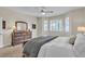 Bedroom with window seat and wooden dresser at 8501 Vivid Violet Ave, Las Vegas, NV 89143