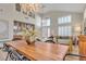 Dining area with long wooden table and stylish chairs at 8501 Vivid Violet Ave, Las Vegas, NV 89143