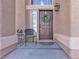 Inviting entryway with wreath, chair, and side table at 8501 Vivid Violet Ave, Las Vegas, NV 89143