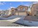 Two-story house with three-car garage and landscaped yard at 8501 Vivid Violet Ave, Las Vegas, NV 89143