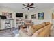 Bright living room with comfy seating, wood floors, and built-in shelving at 8501 Vivid Violet Ave, Las Vegas, NV 89143