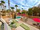 Inviting backyard oasis with a sparkling pool, patio furniture, and lush landscaping at 8501 Vivid Violet Ave, Las Vegas, NV 89143