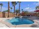 Relaxing kidney-shaped pool with patio and seating area at 8501 Vivid Violet Ave, Las Vegas, NV 89143