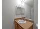 Bathroom with single sink vanity, granite countertop, and a mirror at 8600 W Charleston Blvd # 1034, Las Vegas, NV 89117