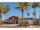 Modern community building with a red roof and palm trees at 8600 W Charleston Blvd # 1034, Las Vegas, NV 89117