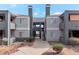 Two-story building with gray siding, red accents, and a walkway at 8600 W Charleston Blvd # 1034, Las Vegas, NV 89117