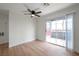 Living room with sliding door to balcony and ceiling fan at 8600 W Charleston Blvd # 1034, Las Vegas, NV 89117