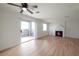 Bright living room features a fireplace and sliding glass door to a balcony at 8600 W Charleston Blvd # 1034, Las Vegas, NV 89117