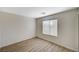 Bedroom features wood-look floors, neutral walls, and a bright window for natural light at 8889 W Torino Ave, Las Vegas, NV 89148