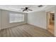 Primary bedroom with ceiling fan, wood floors and natural light at 8889 W Torino Ave, Las Vegas, NV 89148