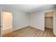 Bedroom showcasing wood-style laminate flooring and two doorways, one to a closet at 8889 W Torino Ave, Las Vegas, NV 89148