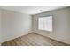 Cozy bedroom with neutral walls, and wood-look floors creating a serene retreat at 8889 W Torino Ave, Las Vegas, NV 89148