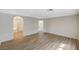 Bonus room with wood-style laminate flooring and doorways to bathroom and hallway at 8889 W Torino Ave, Las Vegas, NV 89148