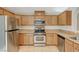 Full kitchen view showcasing stainless steel appliances and wooden cabinetry at 8889 W Torino Ave, Las Vegas, NV 89148