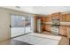 Well-lit kitchen with stainless steel appliances and sliding door to the patio at 8889 W Torino Ave, Las Vegas, NV 89148