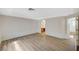 Spacious living room with wood-look floors and bright, neutral paint offers a modern, clean aesthetic at 8889 W Torino Ave, Las Vegas, NV 89148