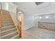 Staircase with wood-style laminate steps leading to a spacious landing area at 8889 W Torino Ave, Las Vegas, NV 89148