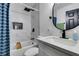 Modern bathroom with marble tile, a bathtub, and updated fixtures at 909 Hassett Ave, Las Vegas, NV 89104