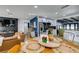 Open concept dining area with wood table and metal chairs at 909 Hassett Ave, Las Vegas, NV 89104