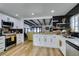 Modern kitchen with white cabinets, stainless steel appliances, and a large island at 909 Hassett Ave, Las Vegas, NV 89104