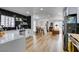 Modern kitchen with white cabinets, island, and stainless steel appliances at 909 Hassett Ave, Las Vegas, NV 89104