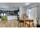 Modern kitchen with white cabinets, quartz countertops, and black tile backsplash at 909 Hassett Ave, Las Vegas, NV 89104