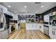 Modern kitchen with white cabinets, stainless steel appliances, and a large island at 909 Hassett Ave, Las Vegas, NV 89104