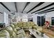 Living room features exposed wood beams and comfortable seating at 909 Hassett Ave, Las Vegas, NV 89104