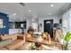 Living room with hardwood floors, leather couches, and view to kitchen at 909 Hassett Ave, Las Vegas, NV 89104